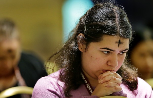 University of Redlands student Vanessa Contreras, 18, listens to Gerald Barnes, bishop of the Diocese of San Bernardino, during a Wednesday, Feb. 14, Mass on campus.Photo by Terry Pierson, The Press-Enterprise/SCNG