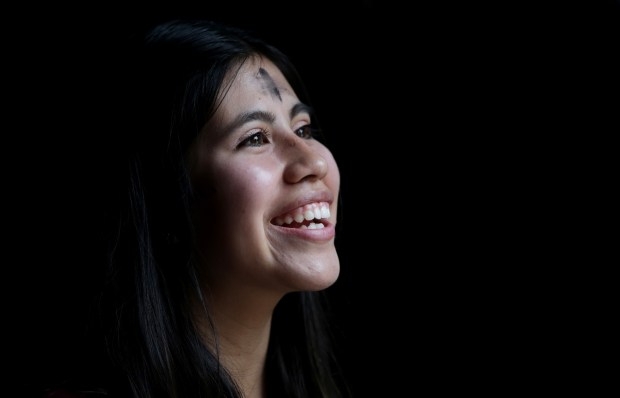 University of Redlands student Paola Antonio, 21, smiles as she greets fellow students after receiving ashes from Bishop Gerald Barnes on Wednesday, Feb. 14.Photo by Terry Pierson, The Press-Enterprise/SCNG