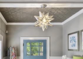 An entryway with a patterned ceiling