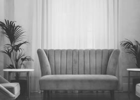 Gray scale image of a couch in a living room