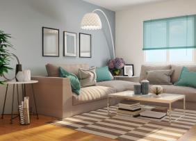 a gray living room witth teal accents