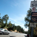 When does a speed limit become become effective, before or after the sign?