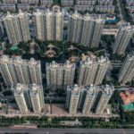 Indebted Evergrande set to raise more cash from partial sale of its property services unit